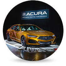 Acura Integra static in showroom with Acura logo